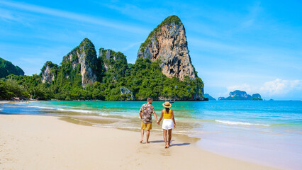 Obraz premium Railay beach Krabi Thailand, couple of men and women on the beach of tropical beach of Railay Krabi