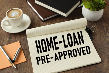 Home loan pre approval. office table and mug with coffee and text on paper. view from above