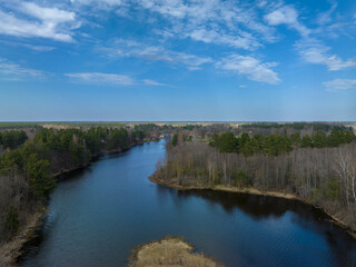 Obraz premium A view of the gas overgrown river Abuls in spring, Latvia