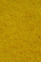 Złoto żółta tapeta wyglądającą jak siano stworzona z gąbki do naczyń w zbliżeniu makro - obrazy, fototapety, plakaty