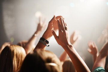 Clapping crowd, party and people at a concert for celebration, performance and watching a band. Energy, audience support and fans applause at a music festival, club or dancing rave show at night - obrazy, fototapety, plakaty