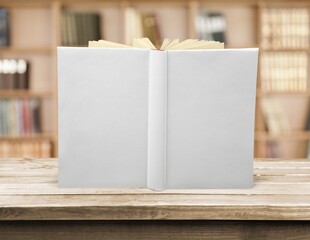 Blank white book mockup on wood desk
