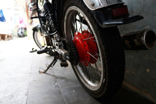 Photo of an old and classic motorbike in a workshop