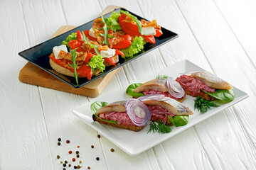 Set of Ukrainian bruschetta with bell pepper and herring. Ukrainian cuisine