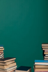 stack of books on a green background learning library learning science