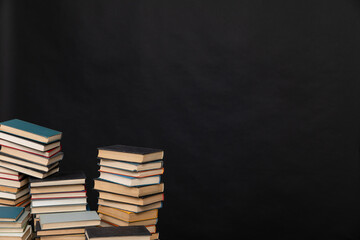 learning library science stack of books on a black background