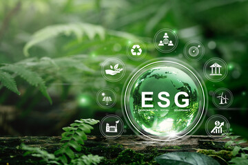 ESG concept of environmental, social and governance. Globe Glass with ESG icons In Green Forest.For...