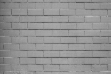 Abstract background of a gray brick wall.
