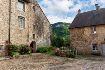 Fototapeta na wymiar THE ABBEY of SAINT-PIERRE-DE-BEAUME GENTLEMEN in the small village of Beaume-le-Monsieur. Jura, France, Europe.