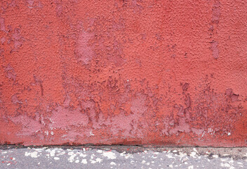 Abstract background from an abandoned red old wall.