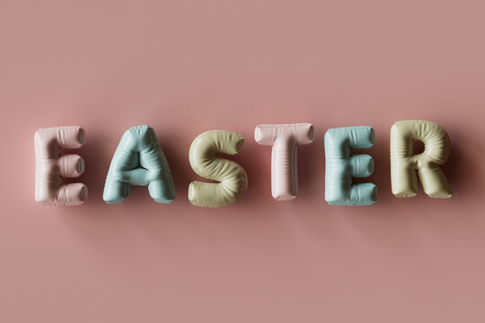 Three dimensional render of inflatable letters spelling word Easter