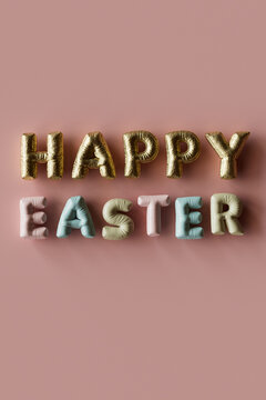 Three dimensional render of inflatable letters spelling phrase Happy Easter