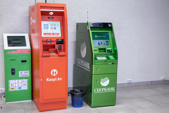 ATMs Kaspi, Sberbank and a terminal for accepting payments. Almaty, Kazakhstan - April 15, 2023