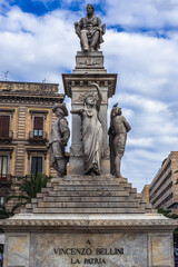 Base sculpture of Vincenzo Bellini monument in historic part of Catania city, Sicily Island, Italy