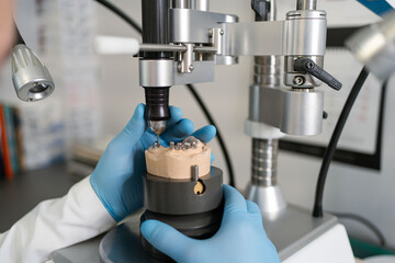 Workplace equipment dental technician. Production of dental crowns or jaws. Drilling dental unit. Drilling machine for creating artificial jaw. Prosthetic dentistry. 