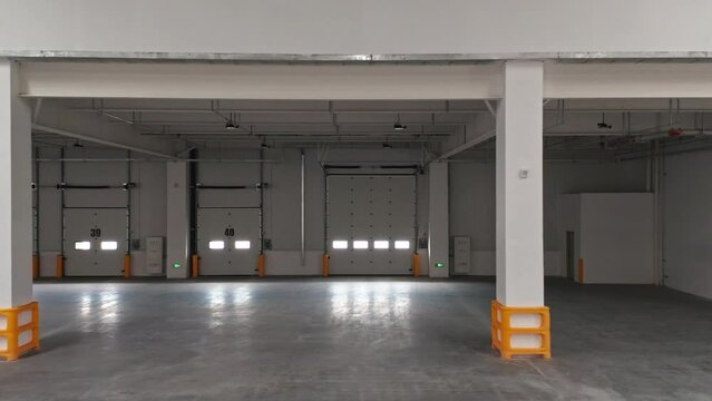Aerial Interior Shot of New Empty Distribution Warehouse Showing Loading Docks