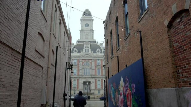 Man walking in alley in Noblesvillle, Indiana.