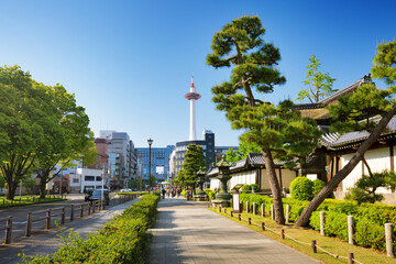 View to Kyoto tower and Kyoto station from a pedestrian way near entrance to Higashi Honganji Temple