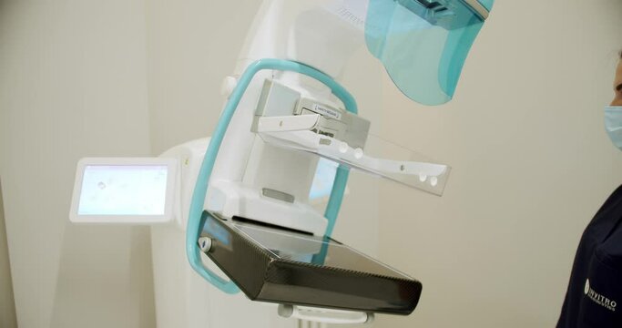 Diagnosis of breast cancer. Medical breast x-ray for women. Cancer Prevention Routine in Hospital Room. Hospital Radiology Room. high-performance Mammography device in a modern hospital.