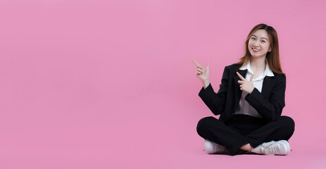 full body image of asian businesswoman posing on pink background