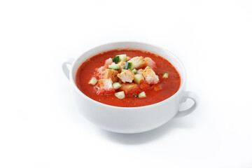 Traditional Spanish gazpacho soup in bowl isolated on white background