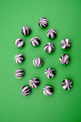 Black and white candies against a colorful background