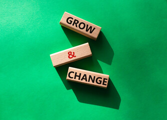 Grow and Change symbol. Concept word Grow and Change on wooden blocks. Beautiful green background. Business and Grow and Change concept. Copy space