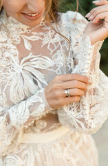 portrait of a contented young bride outdoors in the summer. medium plan. bride on a walk