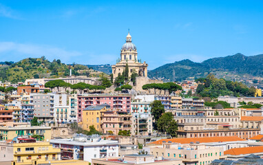 Panoramic view of Messina. Votive Temple of Christ the King or Tempio di Cristo Re on hill over...