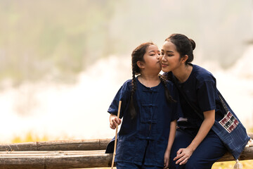 Young girl kissing mother cheek , Family Lovely relationship
