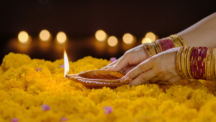 Clay diya lamps lit during diwali celebration, Diwali, or Deepavali, is a festival of lights and is...