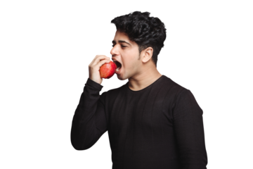 Healthy Snacking diet, Healthy Lifestyle,  jaw excersise, Handsome fit young man eating red apple isolated over a transparent PNG background