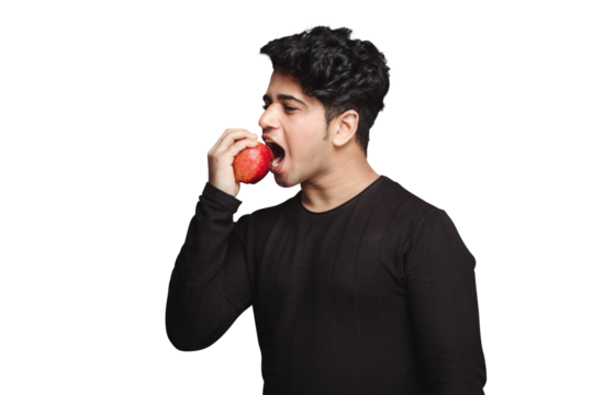 Healthy Snacking diet, Healthy Lifestyle,  jaw excersise, Handsome fit young man eating red apple isolated over a transparent PNG background - Powered by Adobe