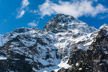 Winter north face with demanding climbing routes on Mount Mieguszowiecki Grand Peak (Velky Mengusovsky stit, Mieguszowiecki Szczyt Wielki). - obrazy, fototapety, plakaty