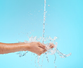 Be picky with your time, your friends and your skincare. Cropped shot of an unrecognisable woman cupping her hands to catch water against a blue background in the studio.