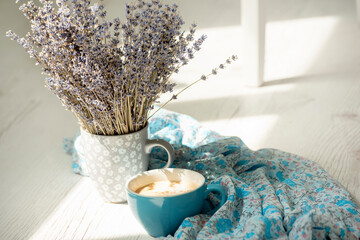 Coffee with milk dress in delicate flowers in Provence style and lavender flowers in a bouquet....