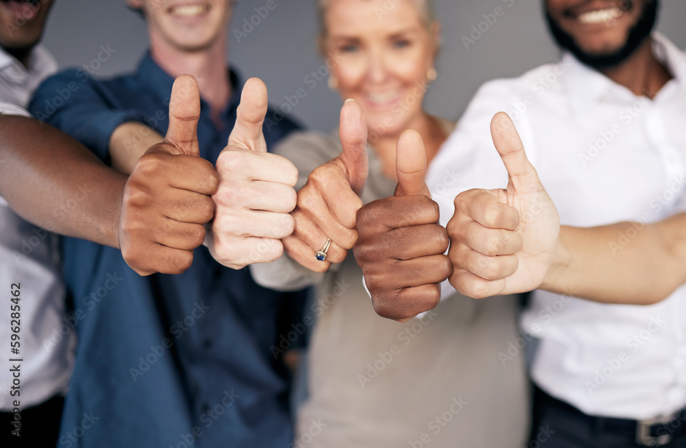 Poster the way a team plays as a whole determines its success. shot of a group of workers showing a thumbs 