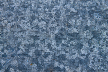 Obraz premium Abstract background of a galvanized steel texture. Metallic surface with a unique crystalline zinc pattern for industrial design.