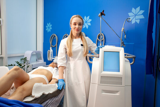 coolsculpting modern fat removal machine, cosmetologist doctor with professional modern cosmetology equipment