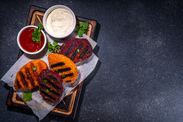 Vegan beetroot carrot cutlets. Vegetable grilled cutlets with ketchup and mayo sauces, summer bbq...