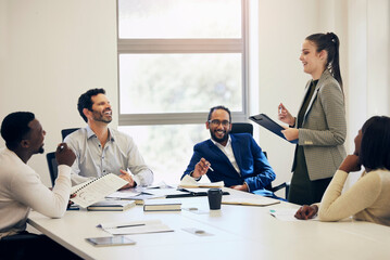 They all love the ideas shes sharing. Shot of a group of businesspeople having a meeting in a boardroom.