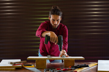 Handsome man working in garage