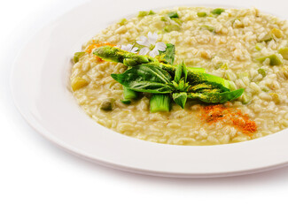 Dish of risotto with asparagus isolated on white plane