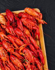 Fragrant boiled crayfish on a wooden board
