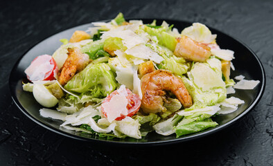 Caesar salad with grilled shrimp and parmesan cheese