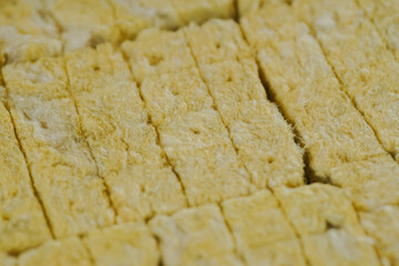 someone cutting rockwool for a hydroponic vegetable nursery.