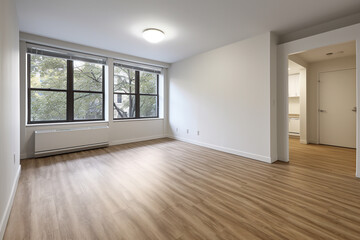 an empty room with hardwood floors and windows. Generative Ai