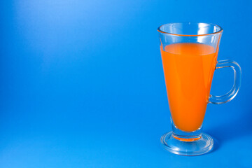 Orange juice in glass with handle