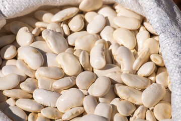 Close-up view full frame background of dried uncooked black-eyed beans seeds stacked together