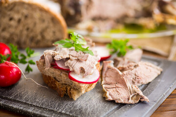 sandwich with baked meat, radish and herbs